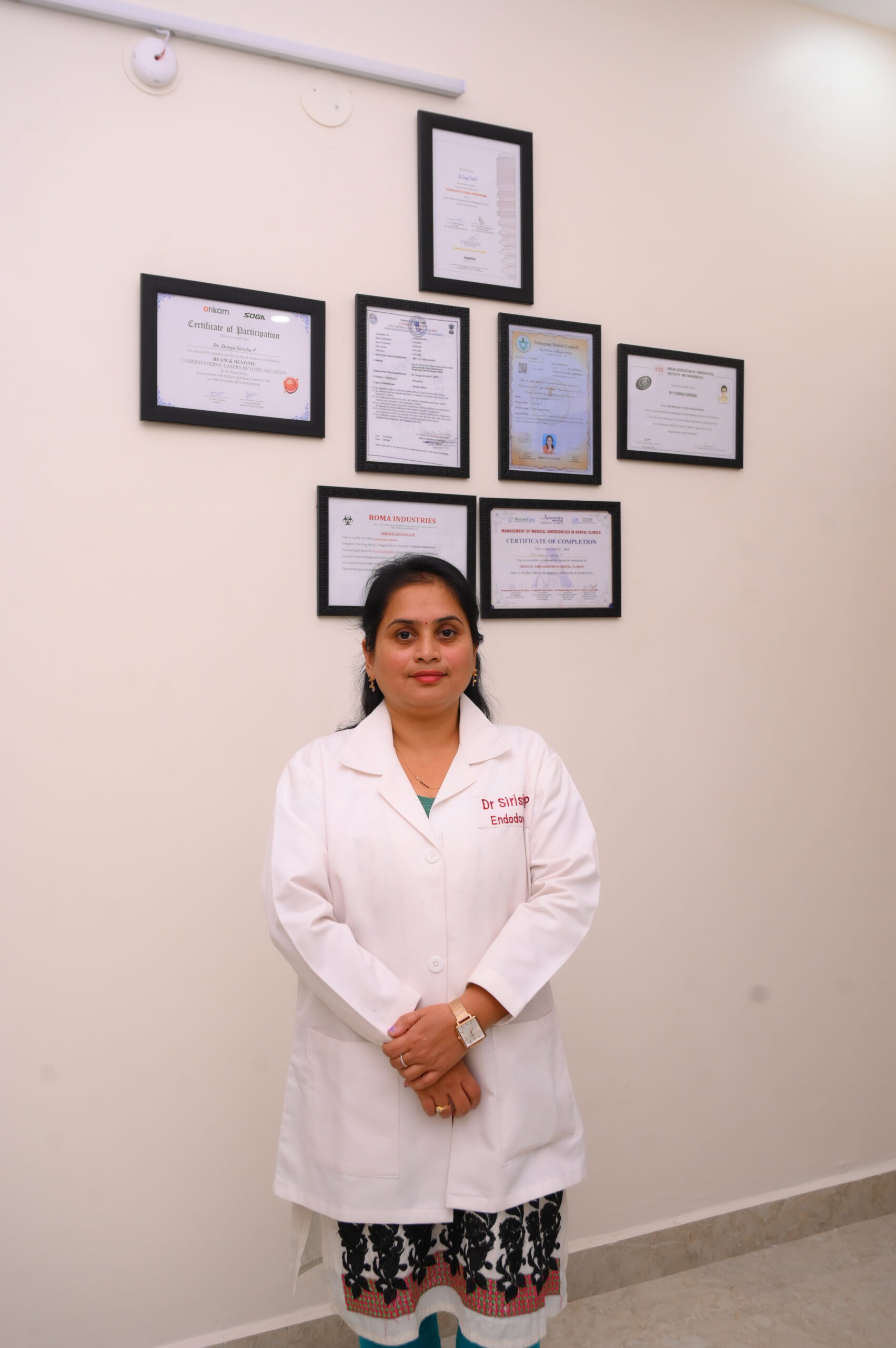 Dr. Sirisha with child patient at SJ Apex Dental Kondapur